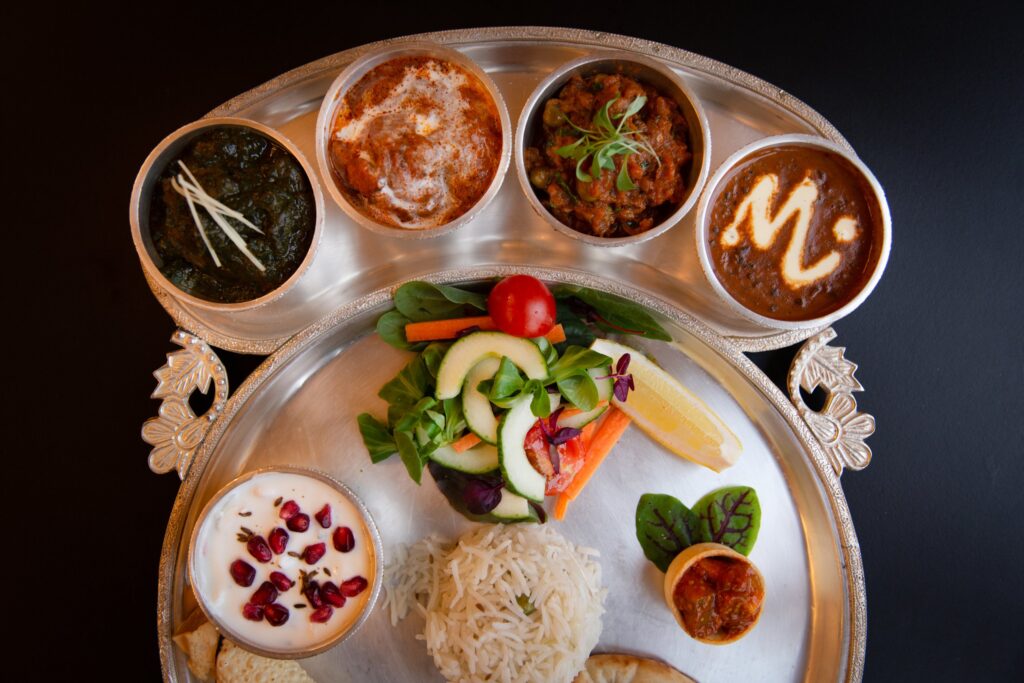 Madhu’s thali with dal makhani, saag, butter chicken and raita at Madhu’s at The Grove
