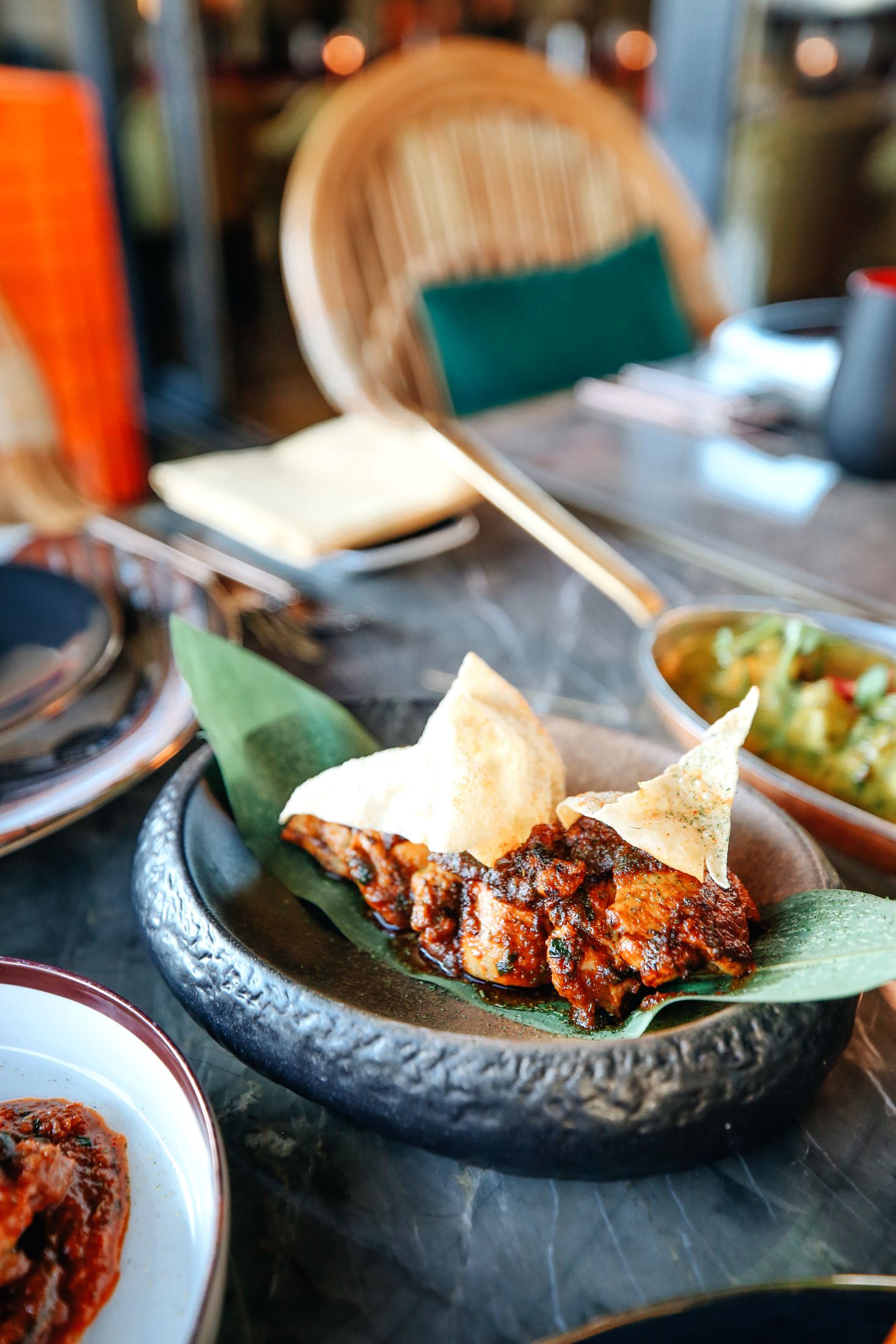 Spiced chicken on a leaf with crisp pastry
